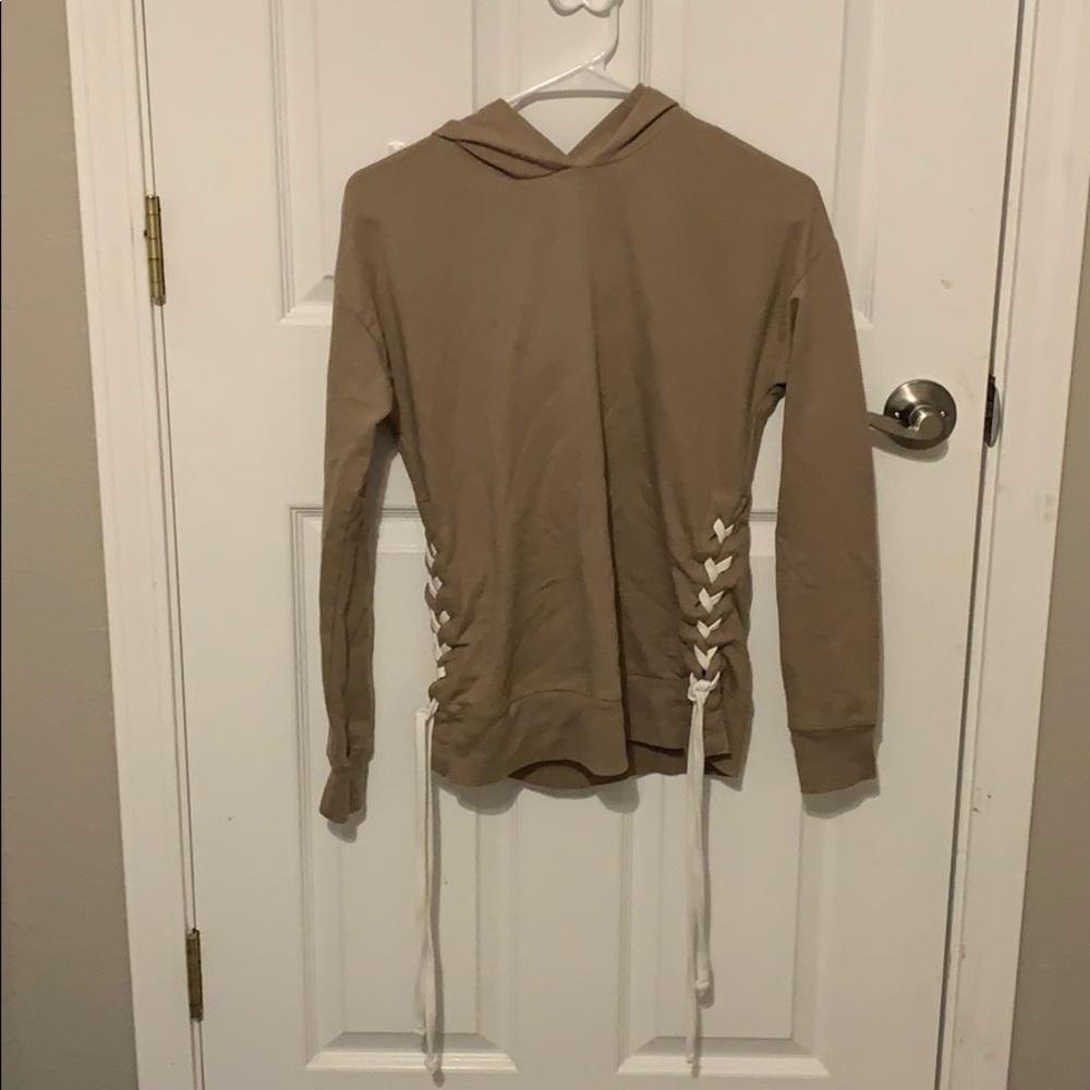 a tan sweater/sweatshirt